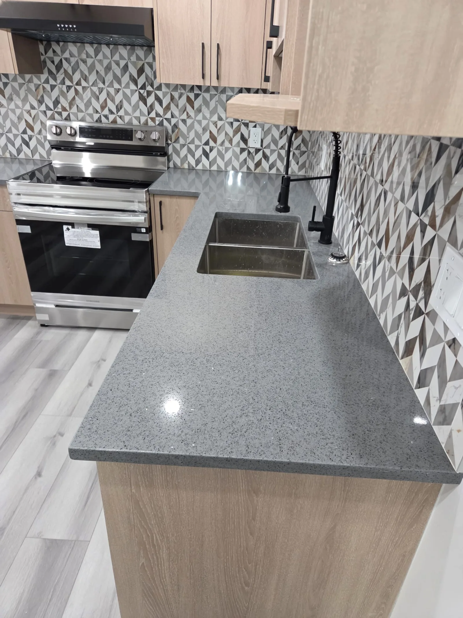 Quartz countertop and tile backsplash, Calgary